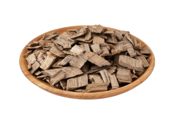 french oak wood chip for smoking meat and fish isolated on white background in bowl