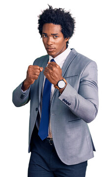 Handsome african american man with afro hair wearing business jacket ready to fight with fist defense gesture, angry and upset face, afraid of problem