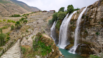 Fototapeta na wymiar Tortum (Uzundere) Waterfall in Erzurum. Turkey's highest waterfall. Tortum Waterfall with a height of 40 meters.