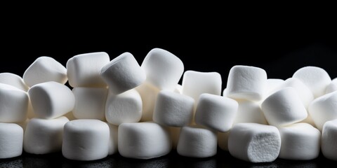 marshmallows on black background close up