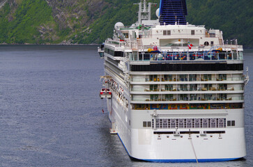 Modern family cruiseship cruise ship liner Star in Geirangerfjord, Norway with breathtaking nature scenery during Norwegian summer landscape cruising