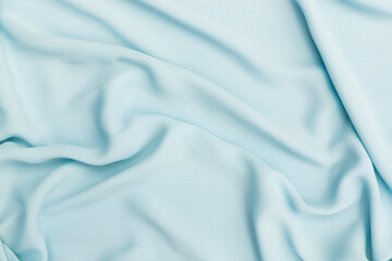 Closeup waving blue fabric background, blank blue fabric texture background