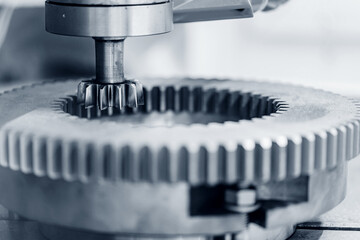 Closeup gears, impaled on shaft spline. Replacement spare part of industry machine tool