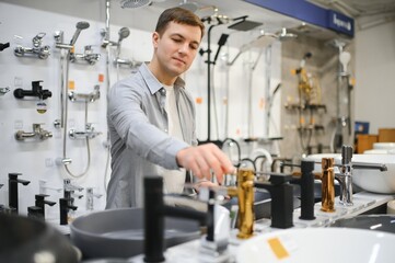 Fototapeta premium Man choosing a batgh sink with sales person