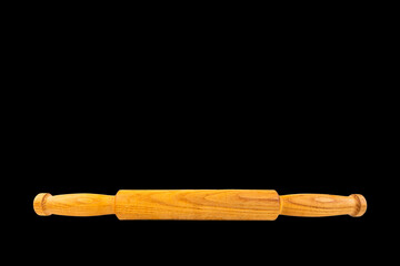 Rolling pin, wooden, kitchen rolling pin. Black isolated background. Menu concept, Recipes. copy space.