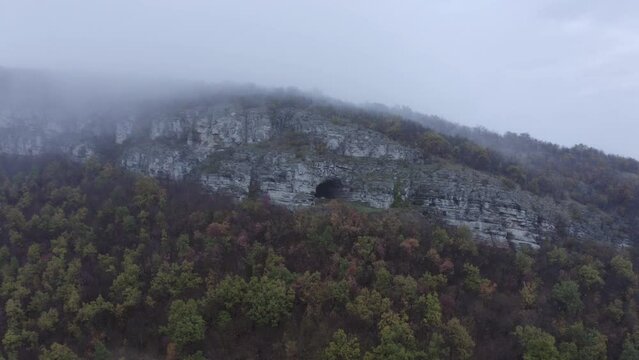 Retreating drone of Kozarnika Cave and showing the rest of the Balkan Mountain range, located in Dimovo Municpality in Bulgaria.