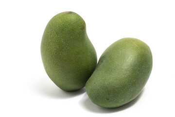 Two fresh organic green mango delicious fruit side view isolated on white background clipping path