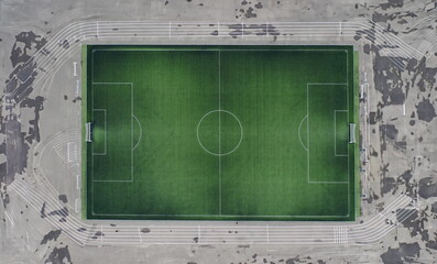 Fototapeta premium Large green football field at stadium. Construction of football arenas and stadiums concept