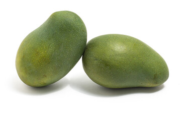 Two fresh organic green mango delicious fruit side view isolated on white background clipping path