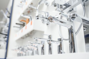 Modern kitchen and bathroom water faucets in the store