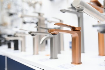 Modern kitchen and bathroom water faucets in the store