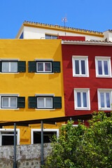 Fototapeta na wymiar Exterior Minorca architecture and European design of colorful buildings with clear blue sky at Mao street in Mahon town- Menorca, Spain