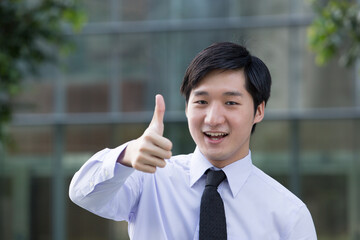 Businessman with thumbs up