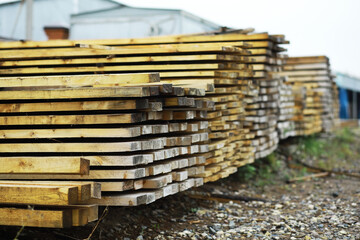 Outdoor lumber storage for the timber industry. Wood processing for both land and water transportation.