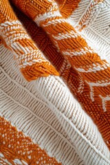 Orange and White Knitted Blanket on Bed