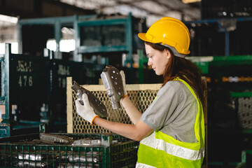 Professional Female engineer is test checking, inspecting and comparing a quality and efficiency of...