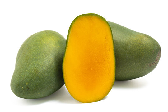 Half cut and two whole fresh organic green mango delicious fruit side view isolated on white background clipping path