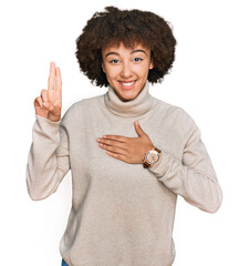 Young hispanic girl wearing wool winter sweater smiling swearing with hand on chest and fingers up,...
