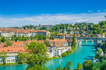Fototapeta na wymiar Panoramic view of Aare river, Nydeggbrucke bridge, cityscape of Bern, Switzerland 