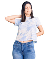 Obraz premium Young beautiful girl wearing casual t shirt suffering of neck ache injury, touching neck with hand, muscular pain