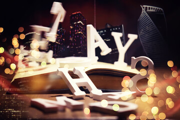 Close up of an unrecognizable man holding a book standing against a evening city panorama. Mock up,...