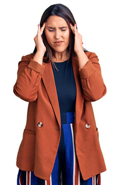 Young beautiful brunette woman wearing elegant clothes with hand on head for pain in head because stress. suffering migraine.