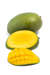Sliced half cut into cubes and whole fresh organic green mango delicious fruit side view isolated on white background clipping path