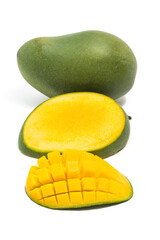 Sliced half cut into cubes and whole fresh organic green mango delicious fruit side view isolated on white background clipping path