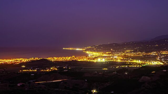 Time Lapse City Dusk, Cars Lights moving at panoramic sea bay with sunset sky
