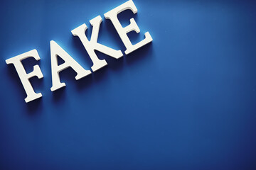 The letters spelled the word fake. The concept of modern information technology. Fake and facts in the news.