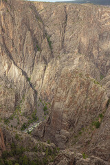 The Gunnison River deep down the canyon in the Black Canyon of the Gunnison seen from Island Peaks...