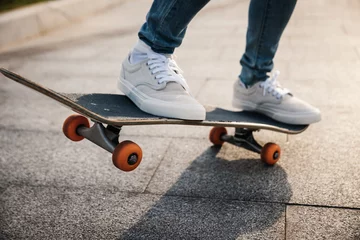 Poster Skateboarder skateboarding outdoors in city © lzf