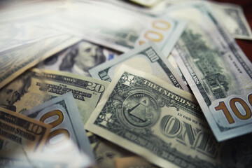 Group of money stack of 100 US dollars banknotes a lot of the background texture. Cash money in a large pile as a finance background.