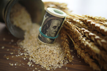 The concept of the cost of grain. 5000 ruble banknotes around a handful of ground grain. World...