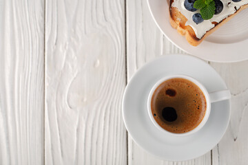 French toast with cheese and blueberries and a cup of coffee. Healthy breakfast