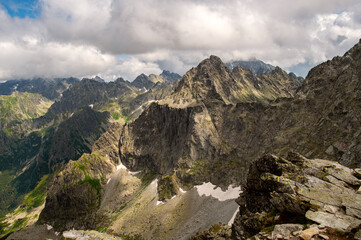 Beautiful landscape of amazing mountains and rocks with dramatic sky near Rysy mountain in High Tatras, Slovakia. 