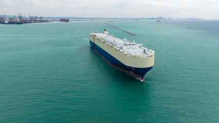 Obraz premium Roll-on Roll-of ship loading new cars line up . Automotive container carriers floating in sea, business services import export goods international by Roll-on Roll-of ship large in the Ocean freight,