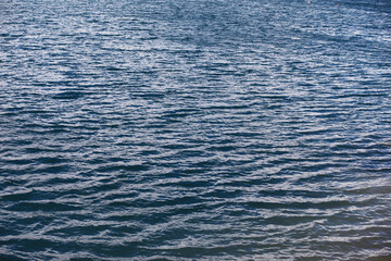 Water surface. The texture of the water. Waves on the lake in windy weather.