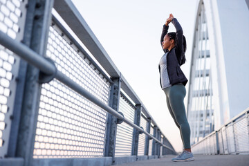 Woman stretching out before going for a morning run