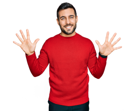 Young hispanic man wearing casual clothes showing and pointing up with fingers number ten while smiling confident and happy.