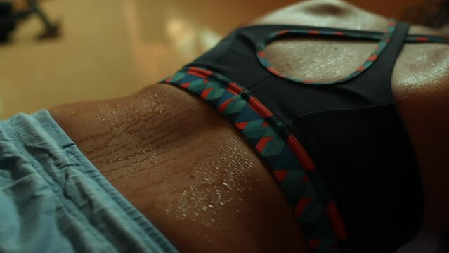 close up of a woman's sweaty back after a workout