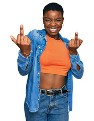 Young african american woman wearing casual clothes showing middle finger doing fuck you bad...