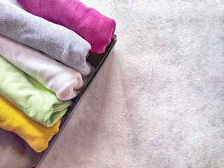 Tidy and organized clothes with the konmari method. Storage of T-shirts folded in a box