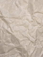 Crumpled paper. Crumpled light parchment. Vintage crumpled paper background