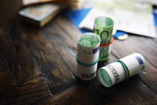 100 euro banknote pack and wood bankground. Currency, financial