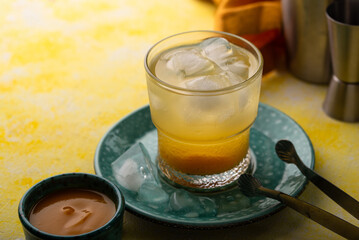 Summer cocktail with mango juice and ice