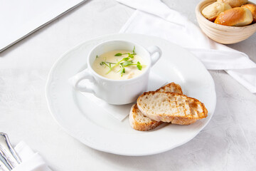 Obraz na płótnie Canvas Cheese cream soup with homemade bread
