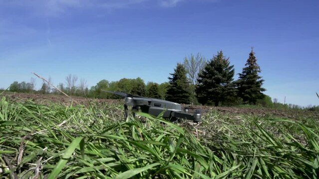 Drone Taking Off in a grass field
