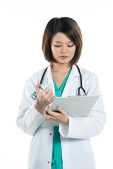 Fototapeta premium Beautiful Chinese doctor wearing green scrubs & lab coat with clipboard.
