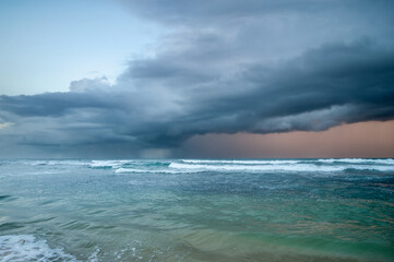 exotic sandy beach on the ocean shore. amazing dramatic sky. natural background